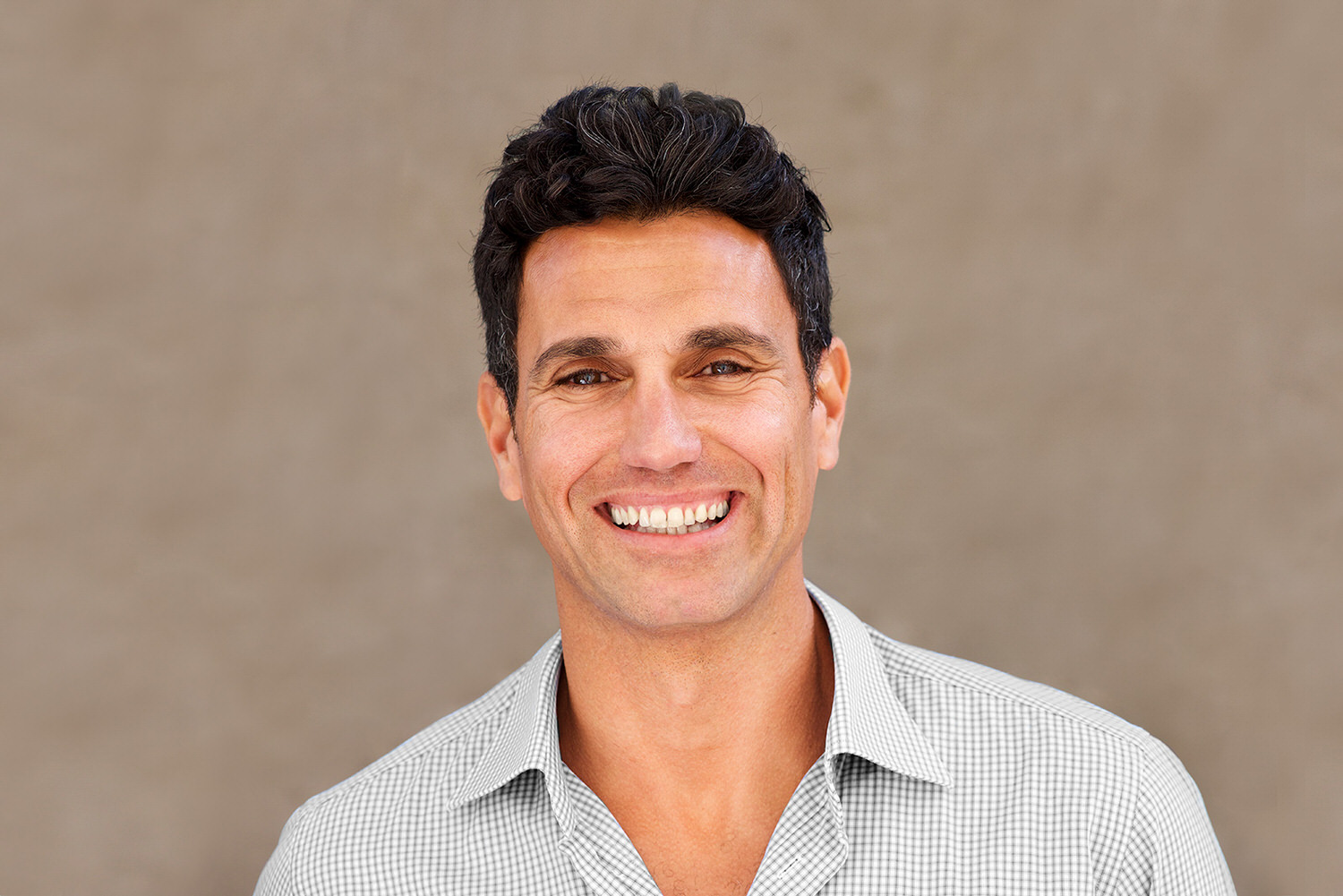Close up handsome casual businessman smiling
